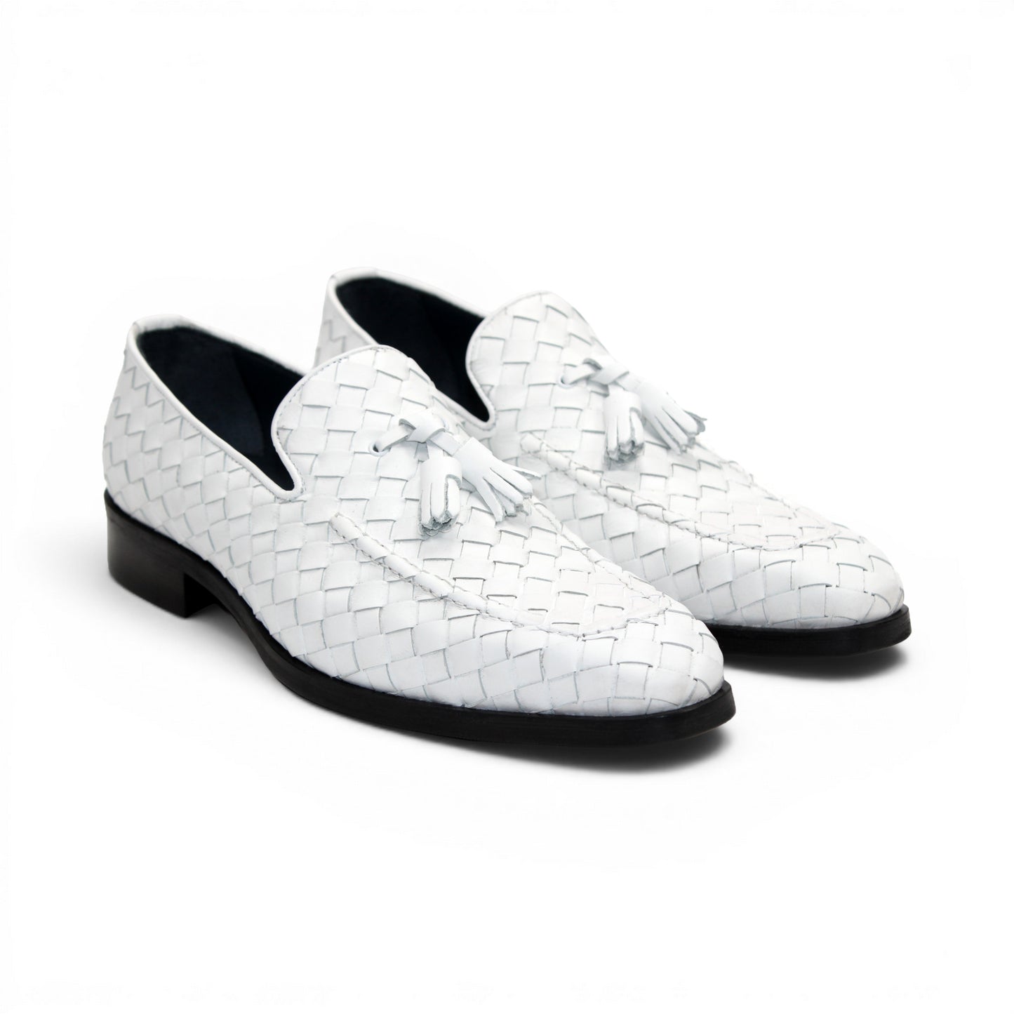 The Duca Tirrenea White by Duca Di Matiste is a white calf weave leather loafer with tassel detail and a black low heel, elegantly crafted in Italy and shown in profile against a plain white background.