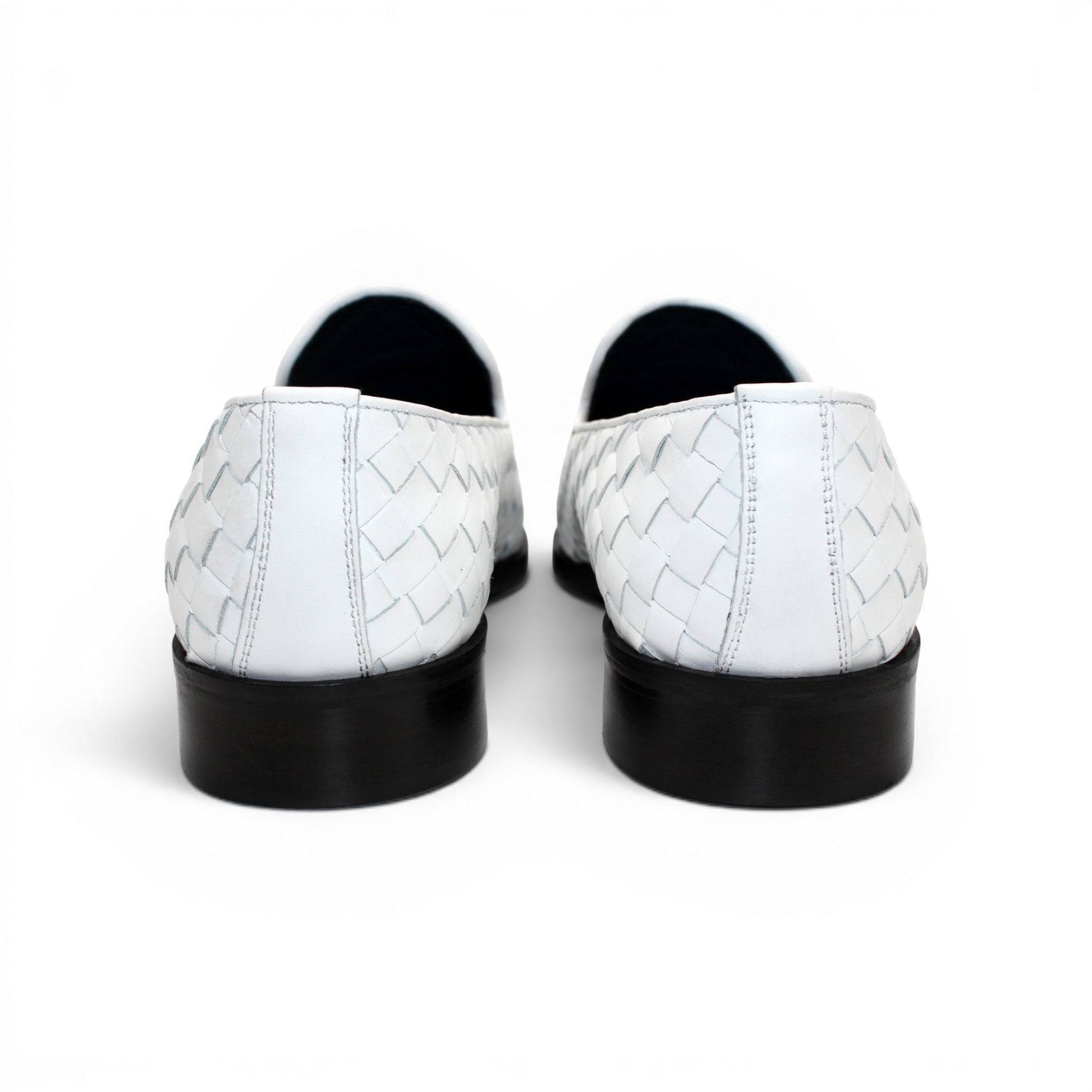 The Duca Tirrenea White by Duca Di Matiste is a white calf weave leather loafer with tassel detail and a black low heel, elegantly crafted in Italy and shown in profile against a plain white background.