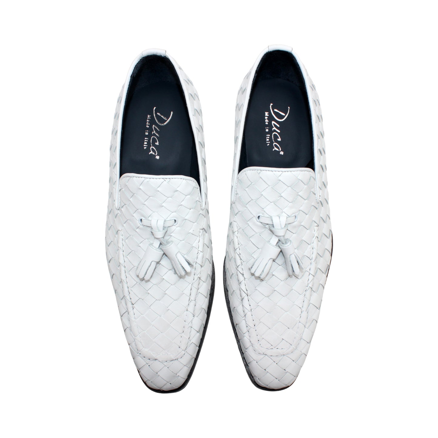 The Duca Tirrenea White by Duca Di Matiste is a white calf weave leather loafer with tassel detail and a black low heel, elegantly crafted in Italy and shown in profile against a plain white background.
