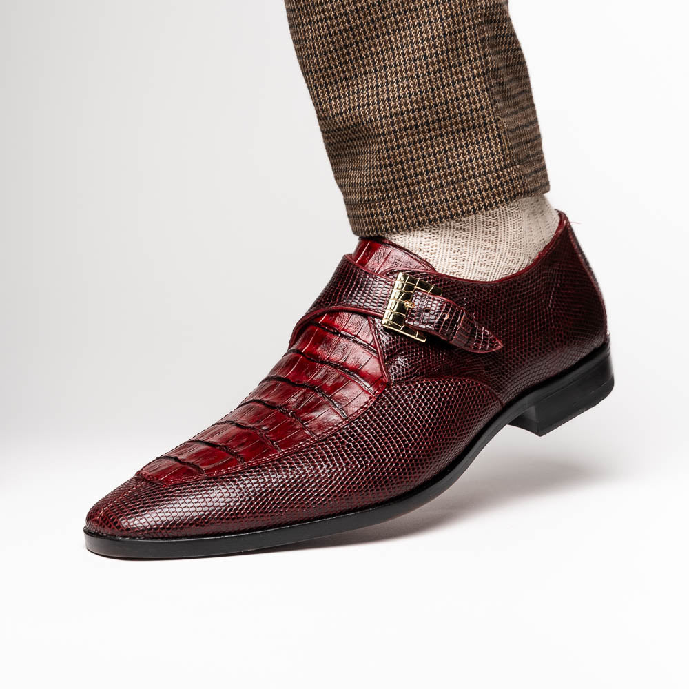 Toluca Wine by Marco Di Milano: Elegant burgundy monk strap shoes with genuine crocodile texture and black soles—one stands upright, the other lies on its side, showcasing luxury craftsmanship.