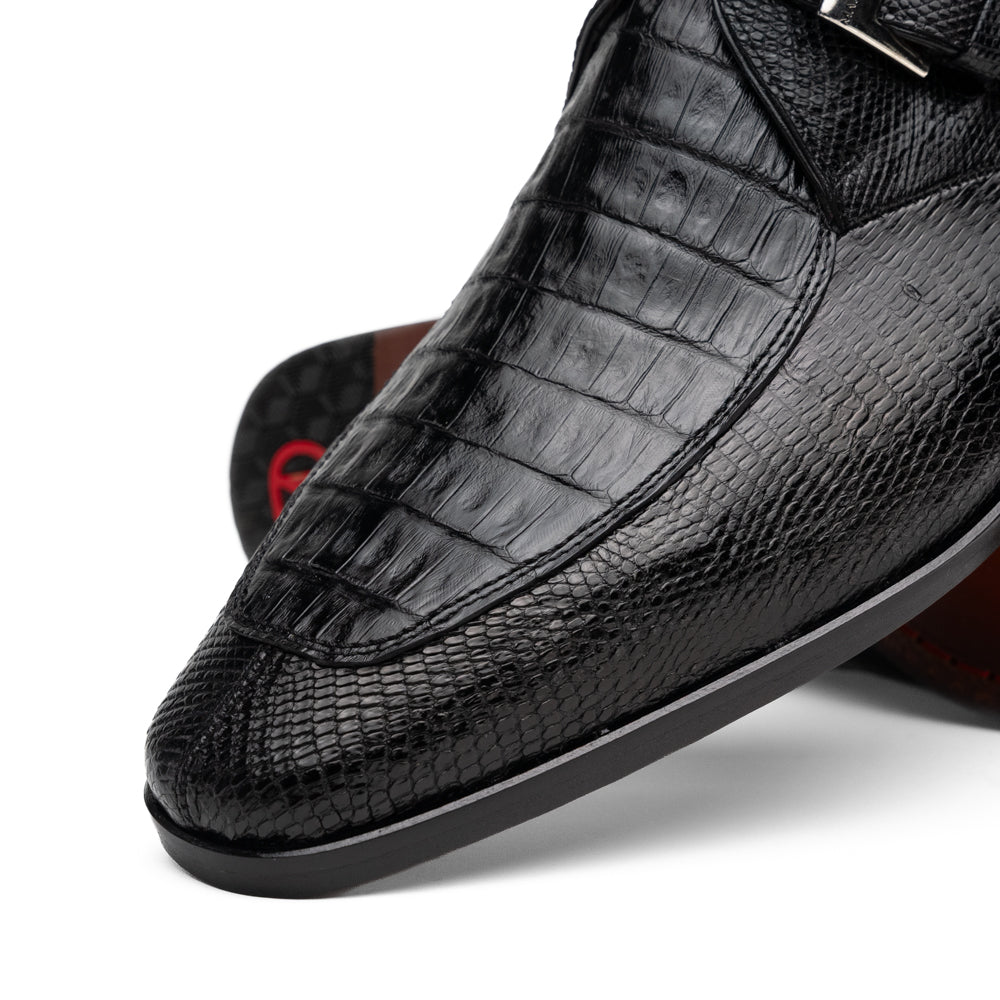 Toluca Black by Marco Di Milano: a black leather dress shoe featuring a crocodile texture and an elegant monk strap side buckle, displayed with one shoe upright and the other revealing its brown leather sole—a refined luxury footwear choice.