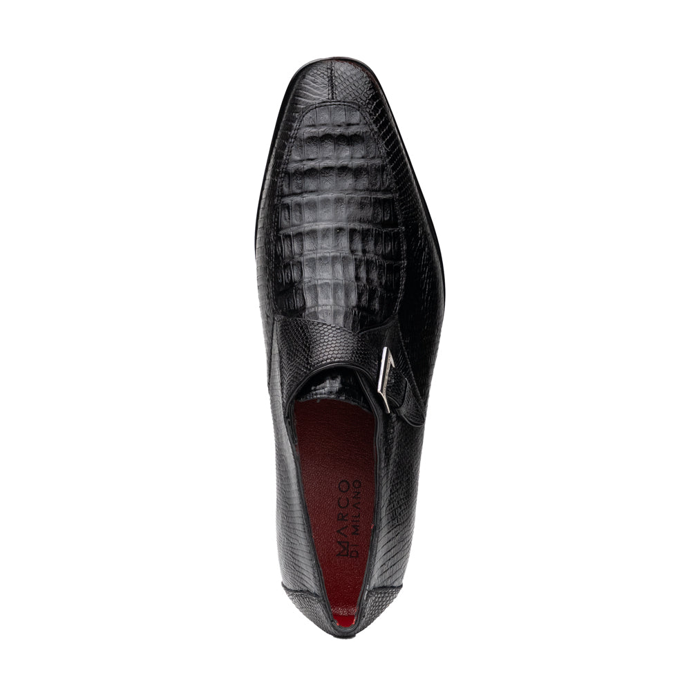 Toluca Black by Marco Di Milano: a black leather dress shoe featuring a crocodile texture and an elegant monk strap side buckle, displayed with one shoe upright and the other revealing its brown leather sole—a refined luxury footwear choice.