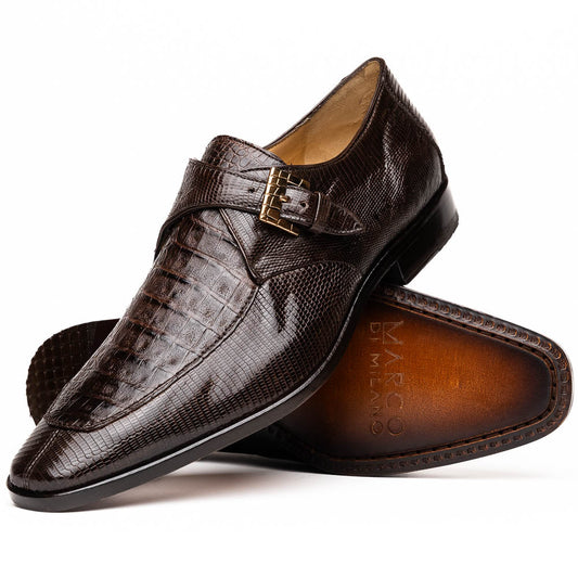 Toluca Brown by Marco Di Milano: luxury men's monk strap shoes in brown crocodile-patterned leather with a side buckle. One shoe stands upright; the other lies on its side to display the sole.