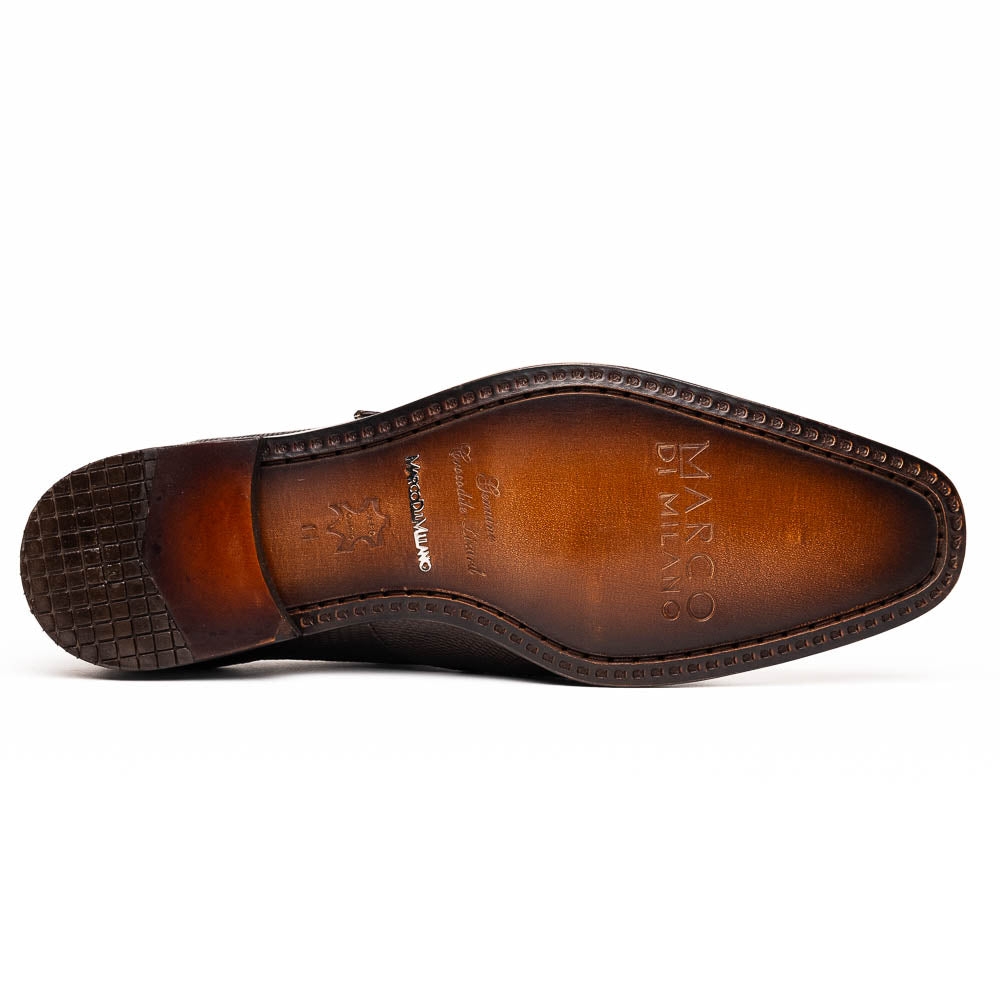 Toluca Brown by Marco Di Milano: luxury men's monk strap shoes in brown crocodile-patterned leather with a side buckle. One shoe stands upright; the other lies on its side to display the sole.