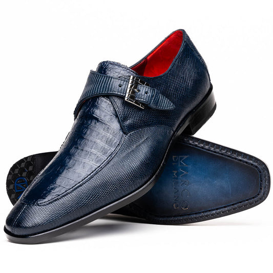 Toluca Navy by Marco Di Milano: a pair of blue textured leather monk strap shoes with a single buckle—one upright, one sole-up showing the brand name—a luxury footwear choice for refined tastes.