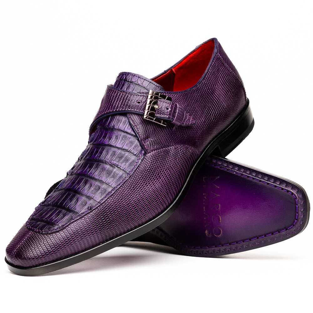 The Toluca Purple by Marco Di Milano is a pair of luxury monk strap shoes with textured purple leather, a silver buckle, red inner lining, and vibrant purple soles—one shoe rests against the other to showcase its unique sole design.