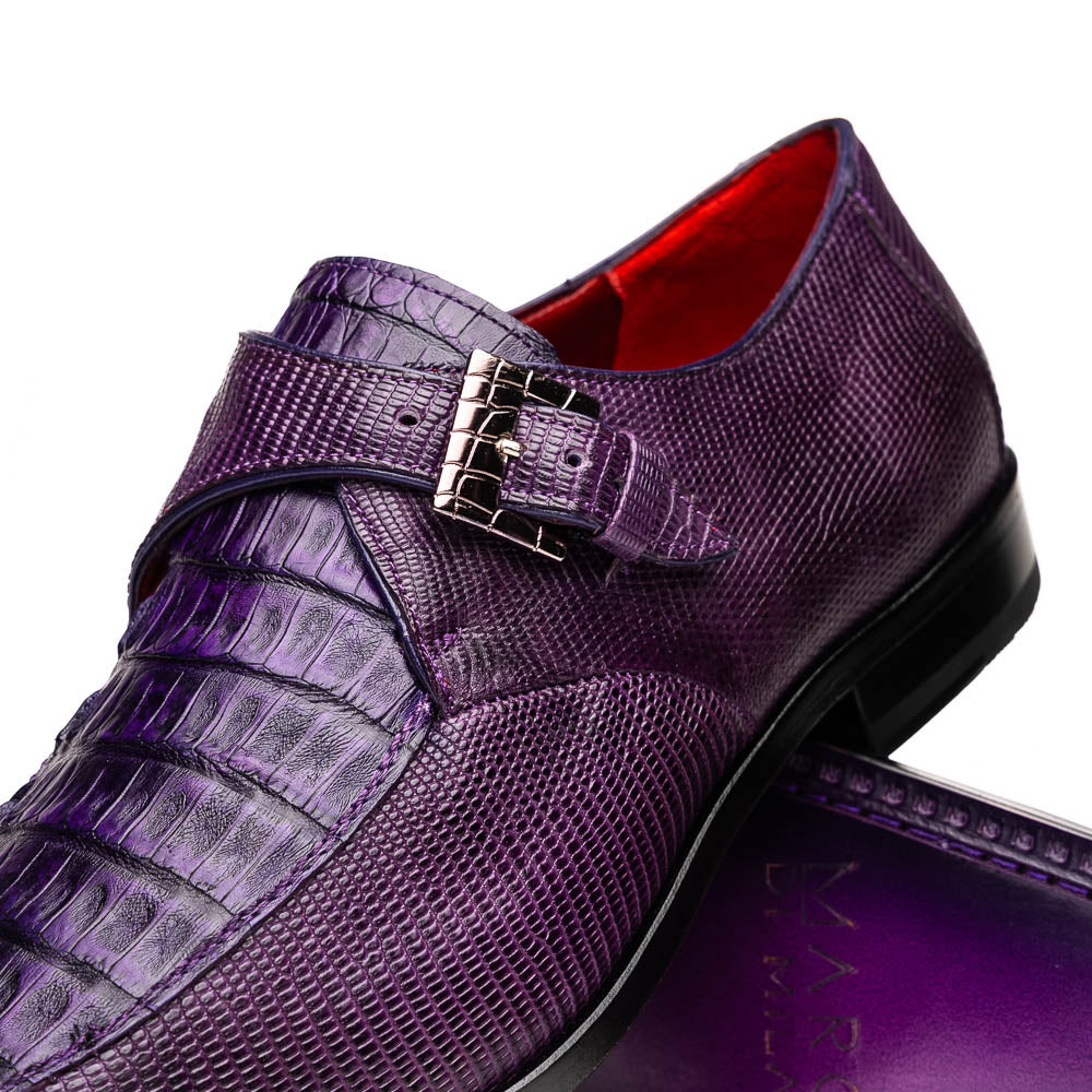 The Toluca Purple by Marco Di Milano is a pair of luxury monk strap shoes with textured purple leather, a silver buckle, red inner lining, and vibrant purple soles—one shoe rests against the other to showcase its unique sole design.