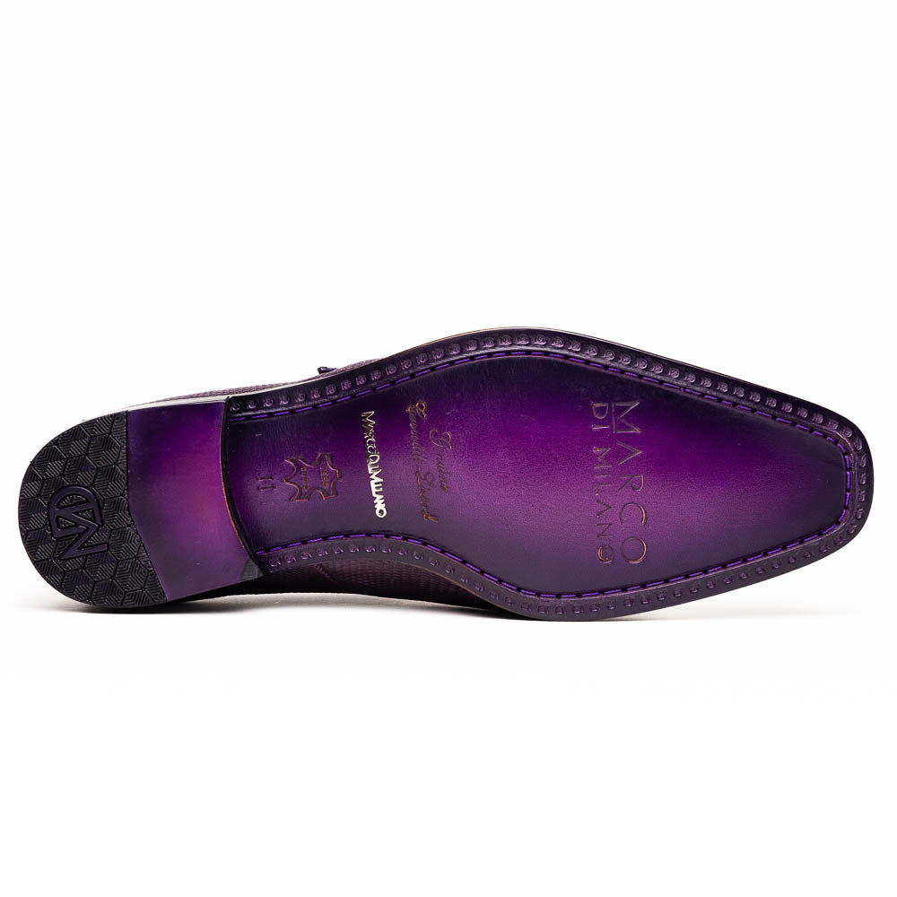 The Toluca Purple by Marco Di Milano is a pair of luxury monk strap shoes with textured purple leather, a silver buckle, red inner lining, and vibrant purple soles—one shoe rests against the other to showcase its unique sole design.
