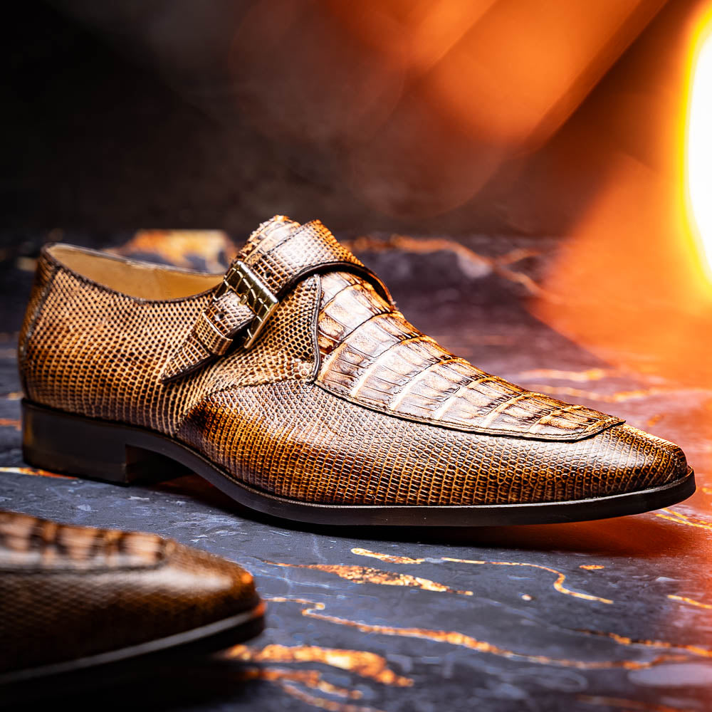 A pair of Toluca Rustic Orix brown leather monk strap shoes by Marco Di Milano, featuring a crocodile pattern—one upright and one showing the branded sole—luxurious footwear perfect for any occasion.