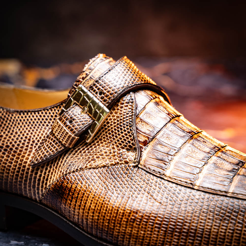 A pair of Toluca Rustic Orix brown leather monk strap shoes by Marco Di Milano, featuring a crocodile pattern—one upright and one showing the branded sole—luxurious footwear perfect for any occasion.