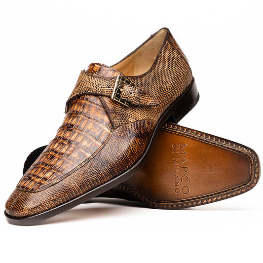 A pair of Toluca Rustic Orix brown leather monk strap shoes by Marco Di Milano, featuring a crocodile pattern—one upright and one showing the branded sole—luxurious footwear perfect for any occasion.