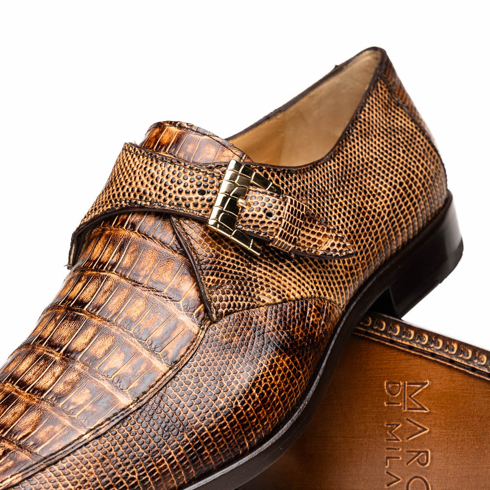 A pair of Toluca Rustic Orix brown leather monk strap shoes by Marco Di Milano, featuring a crocodile pattern—one upright and one showing the branded sole—luxurious footwear perfect for any occasion.