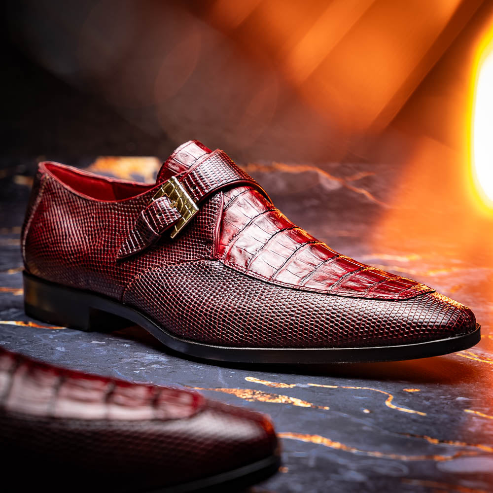 Toluca Wine by Marco Di Milano: Elegant burgundy monk strap shoes with genuine crocodile texture and black soles—one stands upright, the other lies on its side, showcasing luxury craftsmanship.