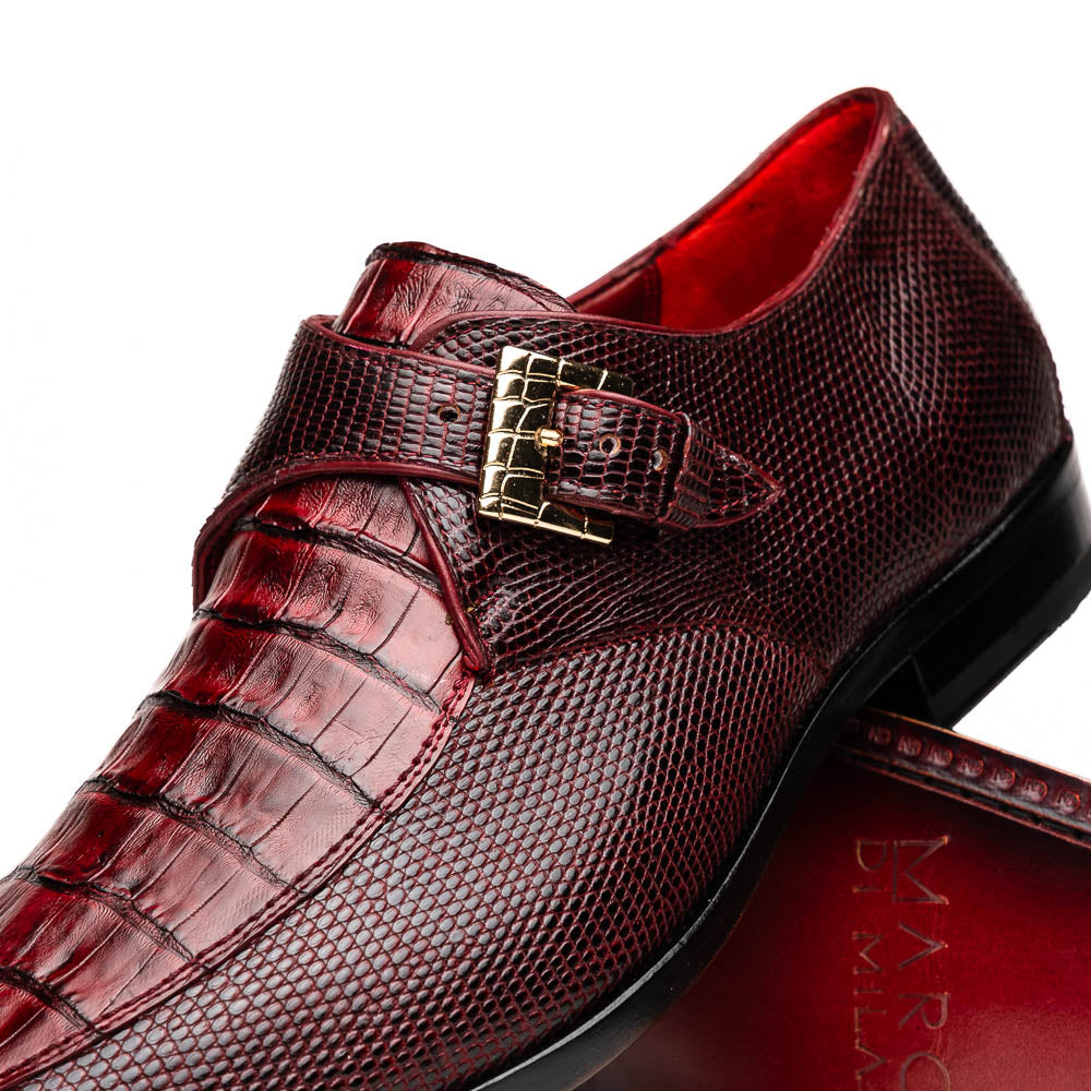 Toluca Wine by Marco Di Milano: Elegant burgundy monk strap shoes with genuine crocodile texture and black soles—one stands upright, the other lies on its side, showcasing luxury craftsmanship.