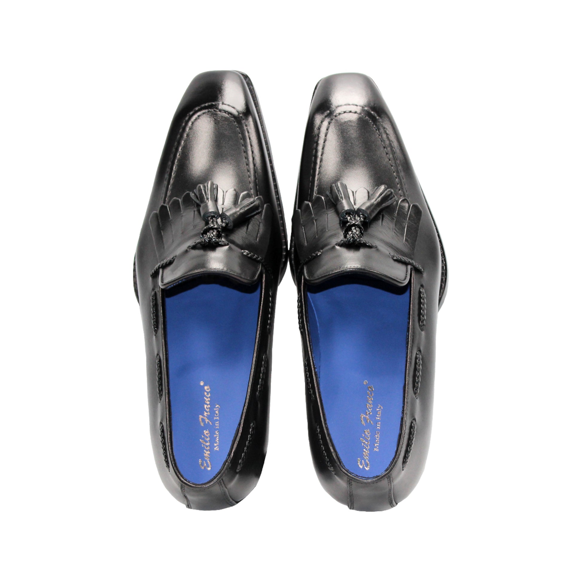 The Emilio Franco Tommaso Black loafer by Emilio Franco features tassel detail, low heel, and stitching accents. Crafted from genuine leather, it's shown from the side on a plain white background.
