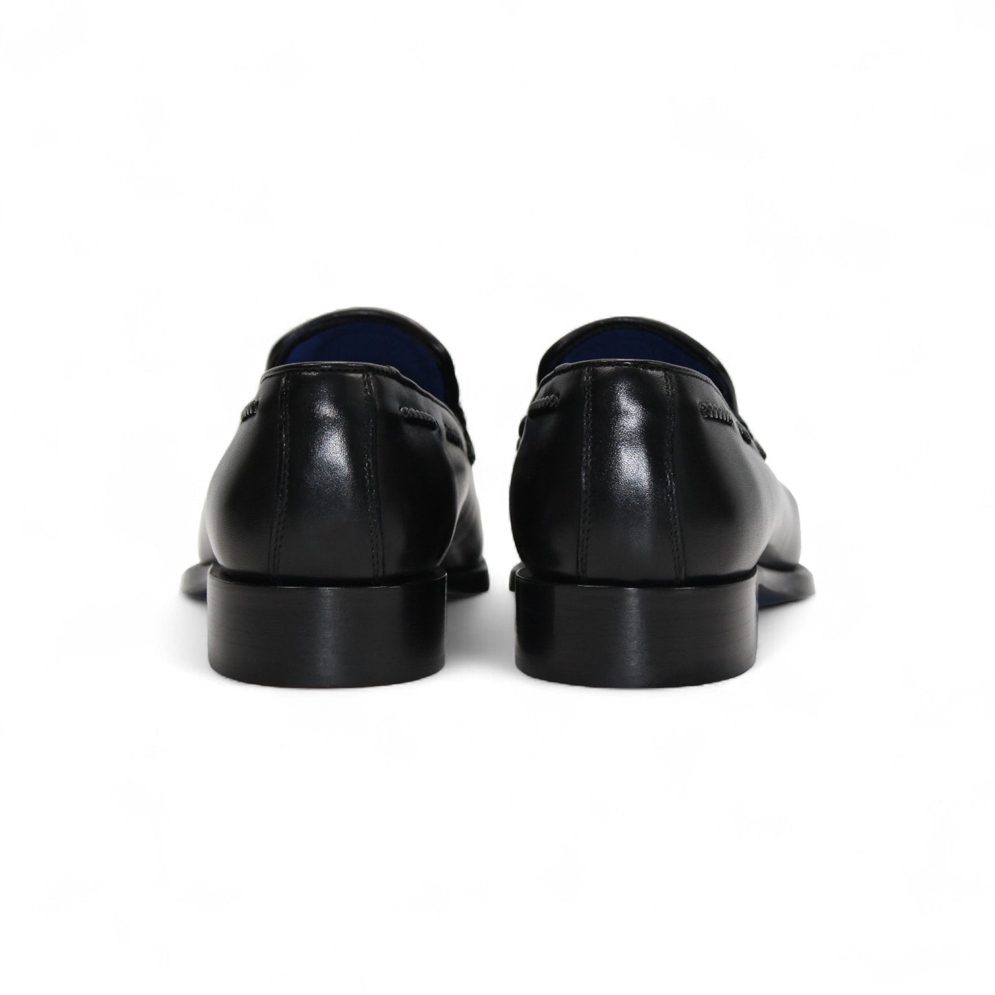 The Emilio Franco Tommaso Black loafer by Emilio Franco features tassel detail, low heel, and stitching accents. Crafted from genuine leather, it's shown from the side on a plain white background.