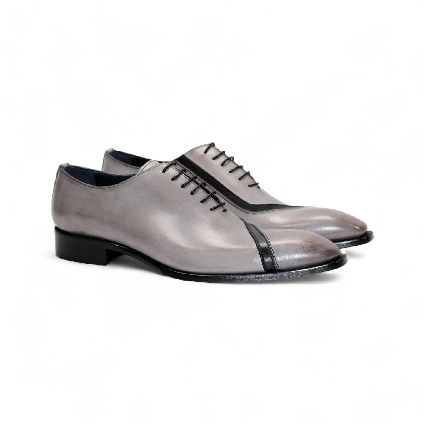 The Duca Di Matiste Duca Torre Light Grey/Black Italian leather oxford dress shoe features a light grey upper, black cap toe, and black sole, displayed against a white background.