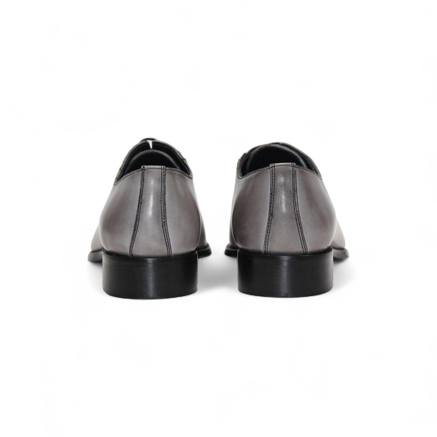 The Duca Di Matiste Duca Torre Light Grey/Black Italian leather oxford dress shoe features a light grey upper, black cap toe, and black sole, displayed against a white background.