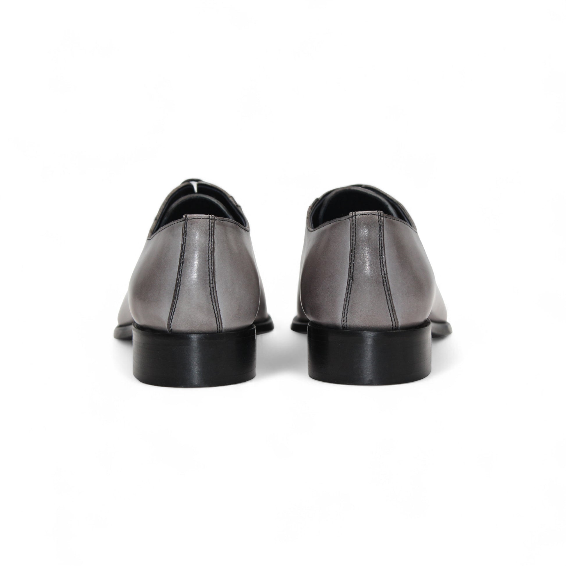 The Duca Di Matiste Duca Torre Light Grey/Black Italian leather oxford dress shoe features a light grey upper, black cap toe, and black sole, displayed against a white background.