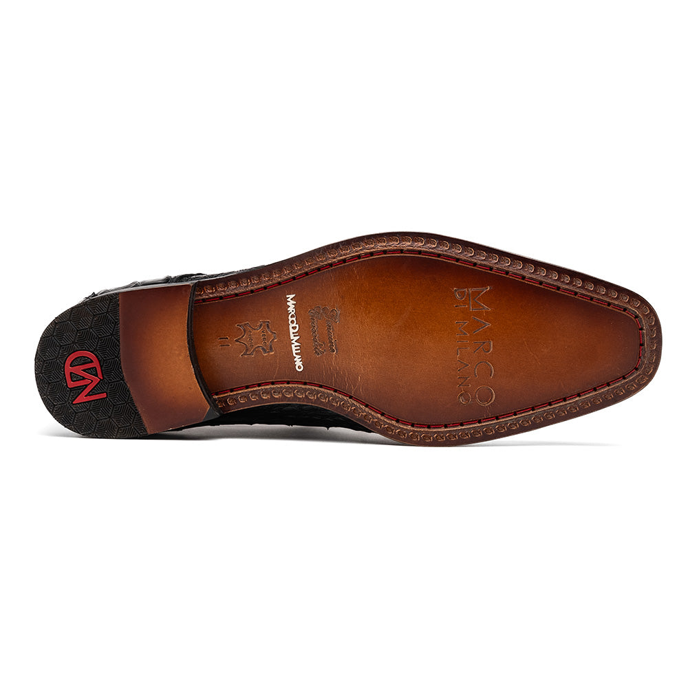 A pair of Marco Di Milano Trento Black loafers crafted from genuine caiman crocodile-pattern leather, showcasing a striking black exterior, red interior lining, and brown soles—one positioned upright and the other on its side. These luxury shoes feature exquisite hand-painted finishes for a truly sophisticated touch.