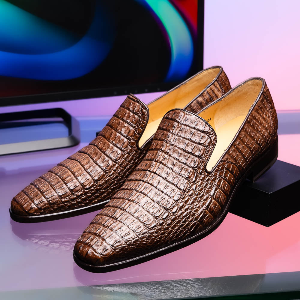 The Marco Di Milano Trento Brown shoes, crafted from genuine caiman crocodile leather, are shown with one upright and one on its side to reveal the sole, highlighting their hand-painted luxury finish.