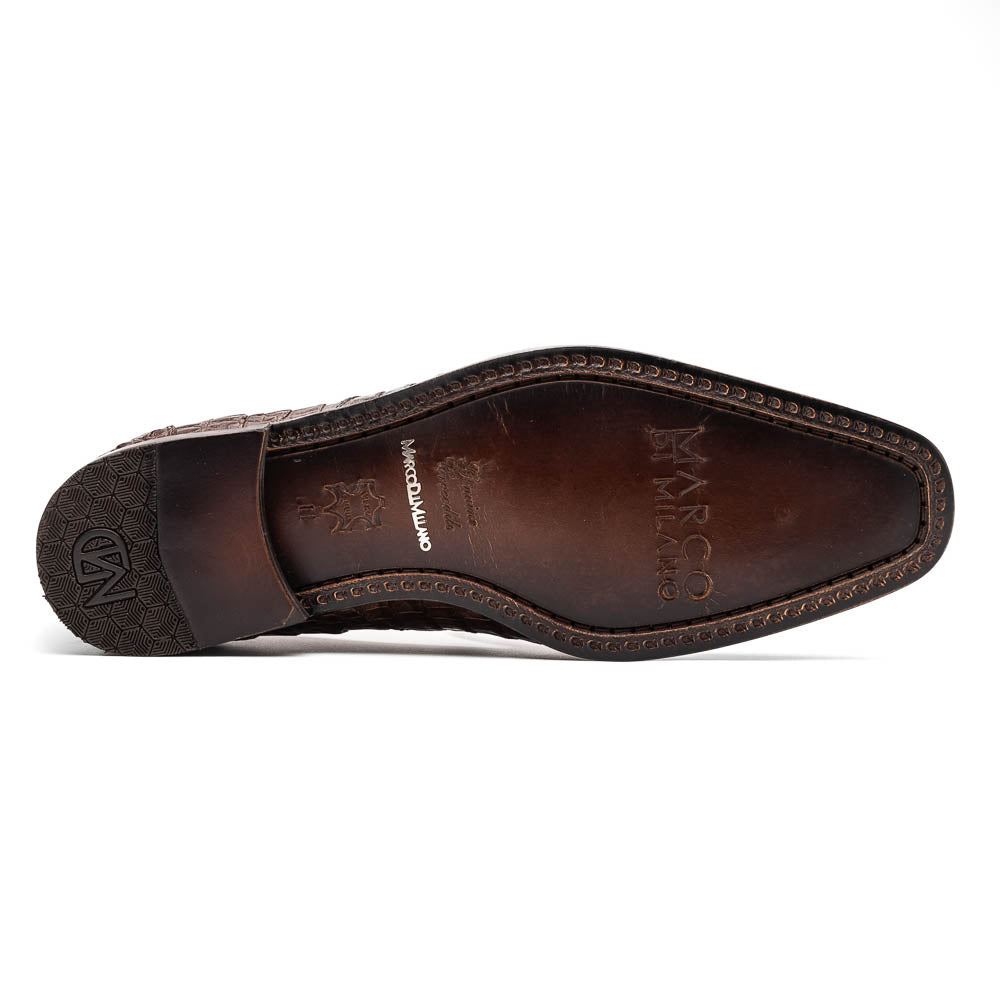 The Marco Di Milano Trento Brown shoes, crafted from genuine caiman crocodile leather, are shown with one upright and one on its side to reveal the sole, highlighting their hand-painted luxury finish.