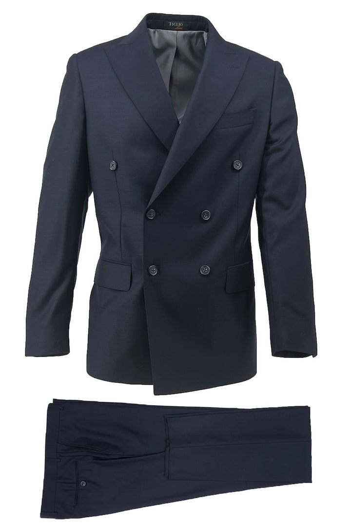 The Tiglio Luxe Navy Pistoia Modern Fit Pure Wool Men’s Suit (TIG1002) by Tiglio Luxe features a double-breasted jacket and matching trousers, crafted from luxurious Italian fabric, shown on a white background.