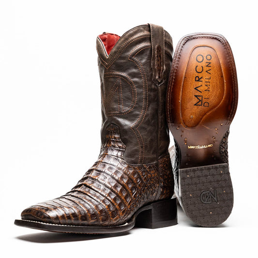 A pair of Marco Di Milano Tucson Aged Brown cowboy boots with textured caiman belly leather—one boot stands upright while the other displays its sole, branded "Marco di Milano.