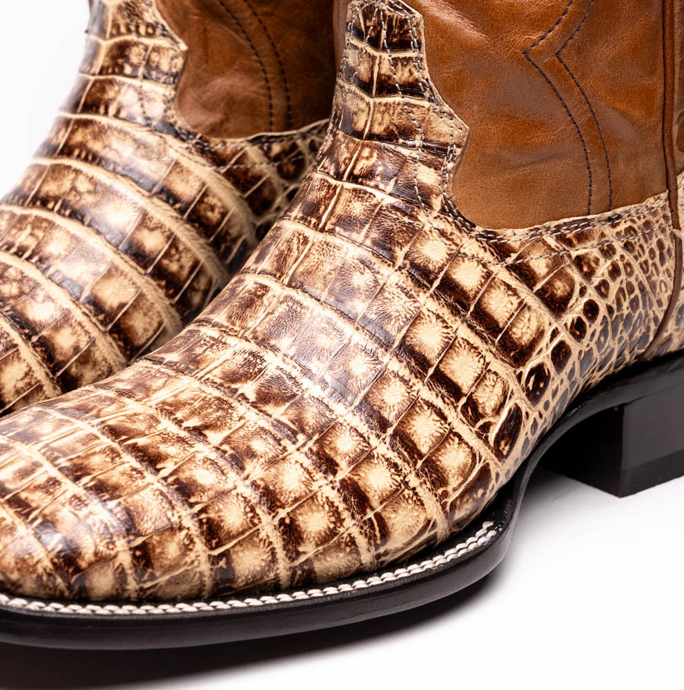 The Marco Di Milano Tucson Stone Orix boots feature genuine caiman belly with brown leather uppers and a crocodile pattern lower, shown from the side and sole.