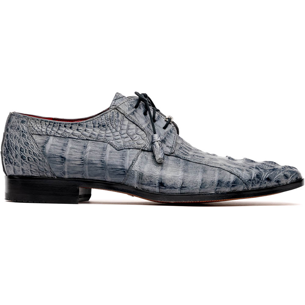 The Tulum Gray by Marco Di Milano is a luxury men’s dress shoe in genuine caiman crocodile leather, featuring black laces and a metal ornament, shown with one shoe on its side to display the branded leather sole.