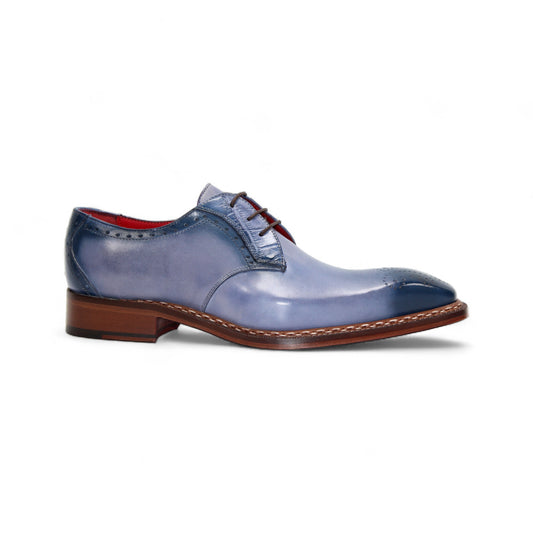 The Fennix Tyler Light Blue by Fennix of Italy is a premium leather dress shoe in light blue, featuring brown laces, a brown sole, and subtle brogue detailing—an elegant display of Italian craftsmanship photographed on a white background.