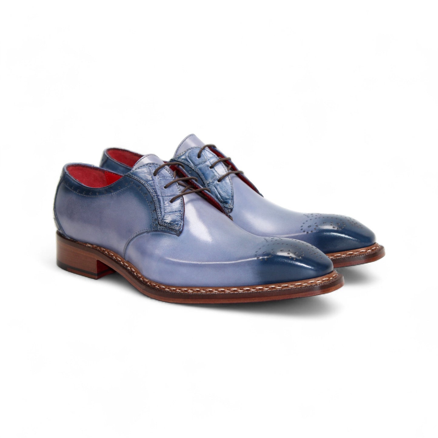 The Fennix Tyler Light Blue by Fennix of Italy is a premium leather dress shoe in light blue, featuring brown laces, a brown sole, and subtle brogue detailing—an elegant display of Italian craftsmanship photographed on a white background.