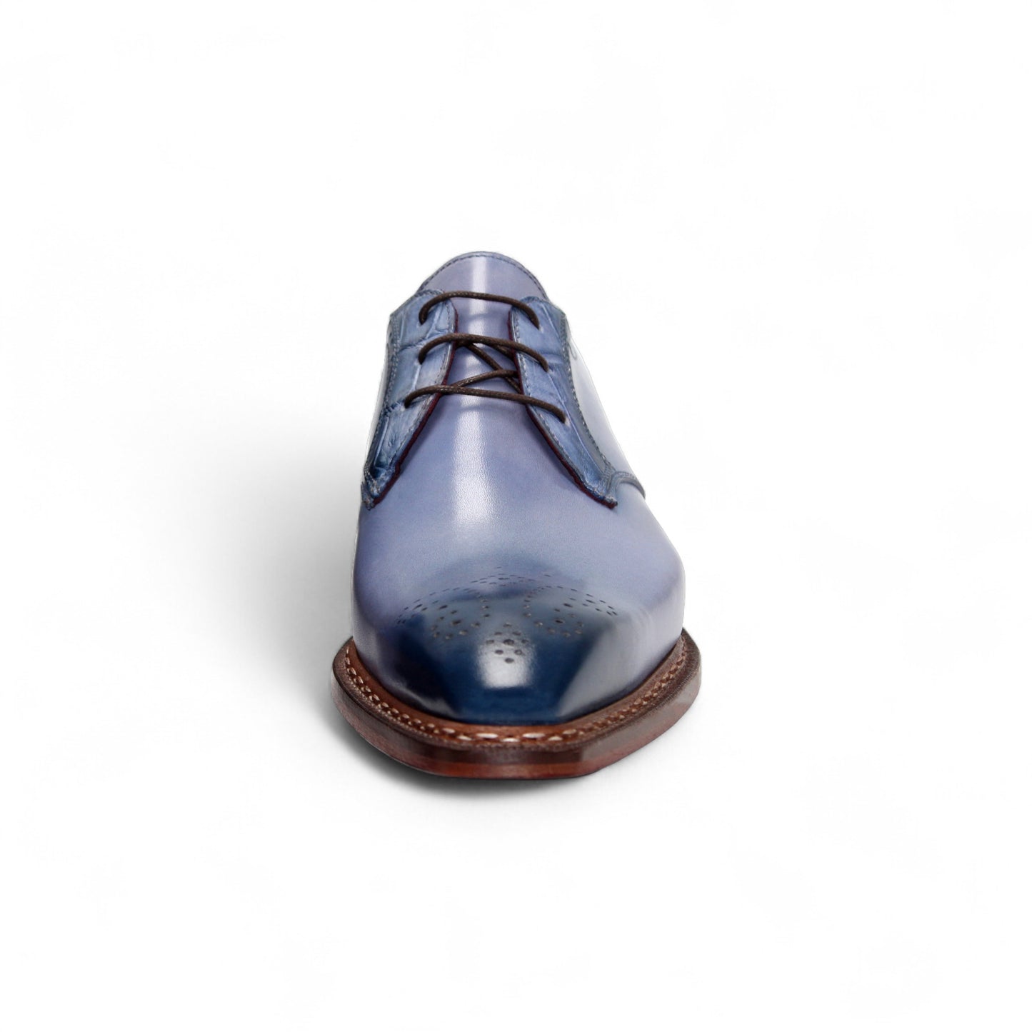 The Fennix Tyler Light Blue by Fennix of Italy is a premium leather dress shoe in light blue, featuring brown laces, a brown sole, and subtle brogue detailing—an elegant display of Italian craftsmanship photographed on a white background.