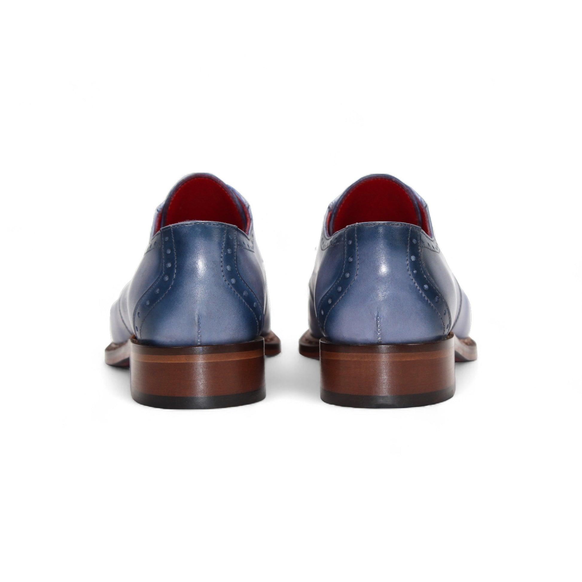 The Fennix Tyler Light Blue by Fennix of Italy is a premium leather dress shoe in light blue, featuring brown laces, a brown sole, and subtle brogue detailing—an elegant display of Italian craftsmanship photographed on a white background.