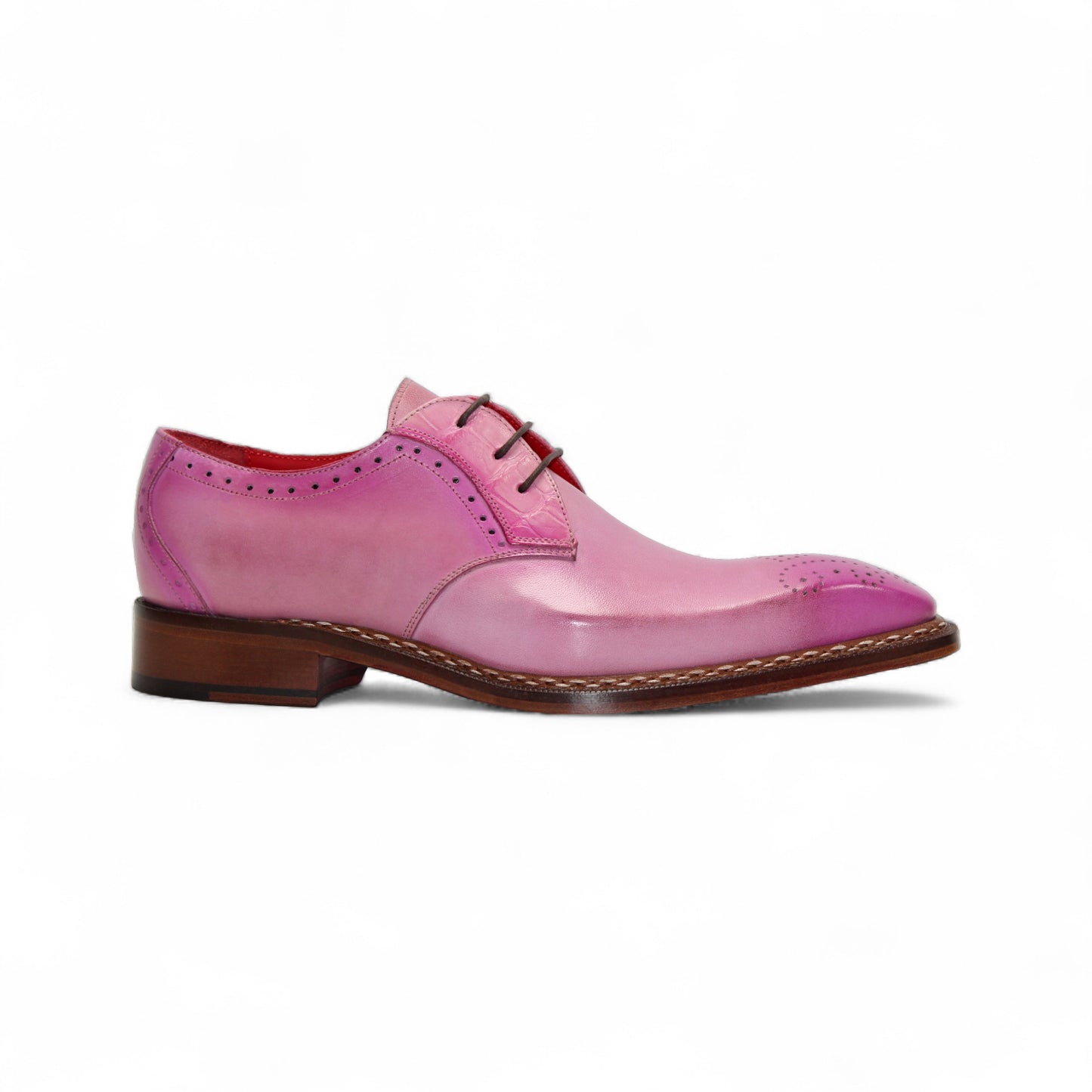 The Fennix Tyler Pink by Fennix of Italy is a pink leather oxford dress shoe with brogue detailing, leather sole, and laces, showcasing Italian craftsmanship on a white background.