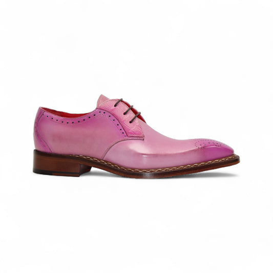 The Fennix Tyler Pink by Fennix of Italy is a pink leather oxford dress shoe with brogue detailing, leather sole, and laces, showcasing Italian craftsmanship on a white background.