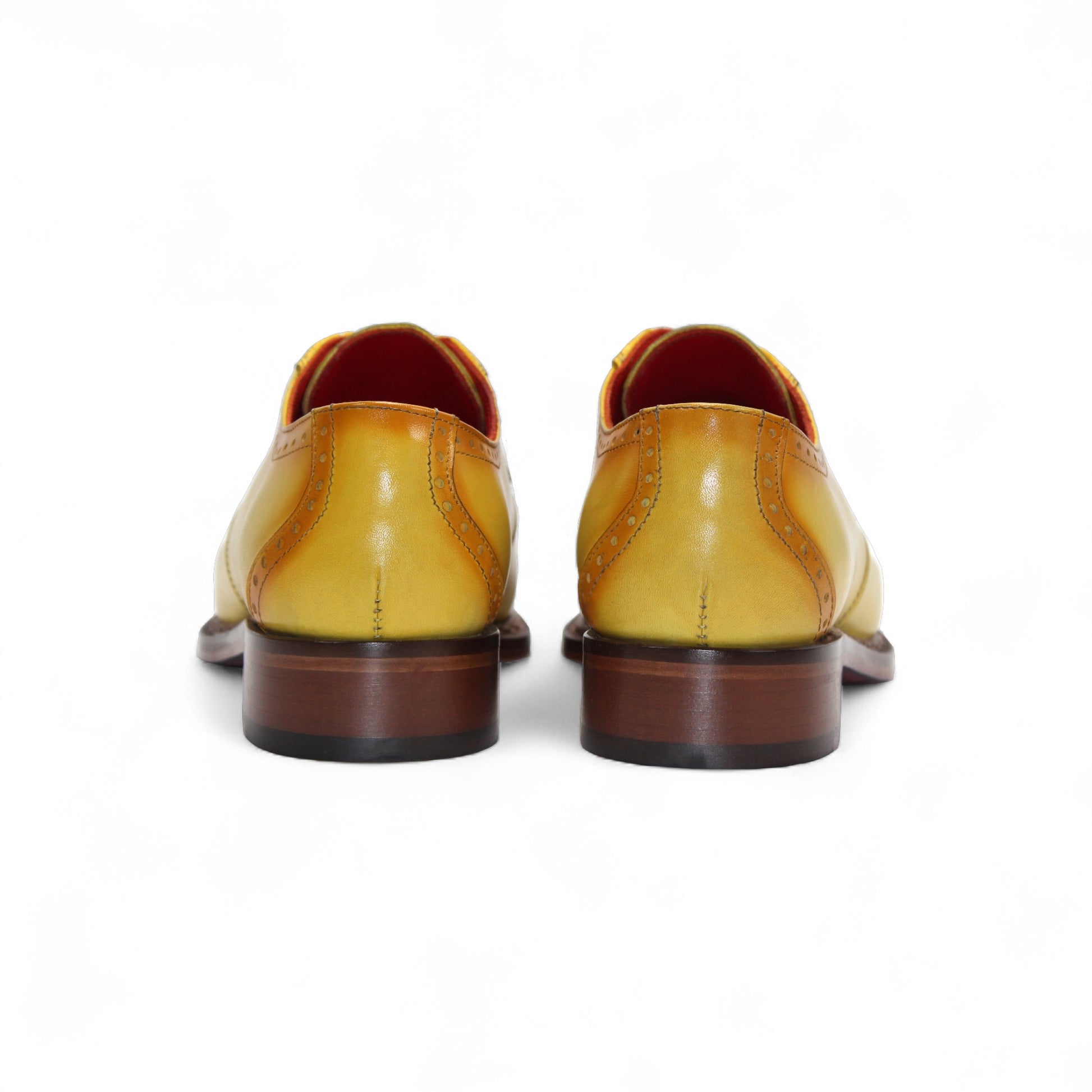 The Fennix Tyler Yellow by Fennix of Italy is a yellow leather oxford dress shoe with brown detailing, red laces, a low wooden heel, and a premium leather sole, photographed on a white background.