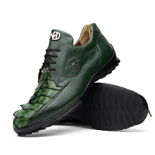 Introducing the Udine Green by Marco Di Milano: luxury men’s shoes in dark green, crafted from exotic hornback caiman leather. These dress shoes showcase a textured, scale-like front design, black laces, and decorative metal initials on the tongue—all displayed against a white background.