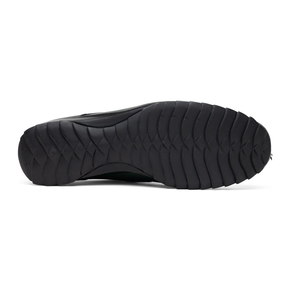 Introducing the Udine Green by Marco Di Milano: luxury men’s shoes in dark green, crafted from exotic hornback caiman leather. These dress shoes showcase a textured, scale-like front design, black laces, and decorative metal initials on the tongue—all displayed against a white background.