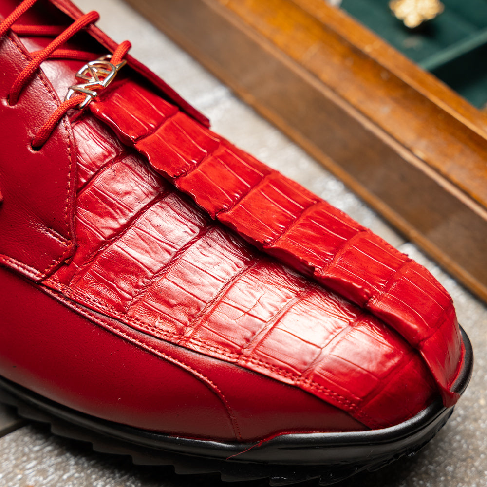 A pair of Marco Di Milano Udine Red glossy hornback caiman sneakers with lace-up fronts, featuring textured detailing and black rubber soles, one luxury men’s sneaker resting elegantly on the other.