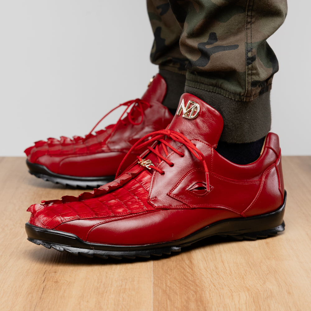 A pair of Marco Di Milano Udine Red glossy hornback caiman sneakers with lace-up fronts, featuring textured detailing and black rubber soles, one luxury men’s sneaker resting elegantly on the other.