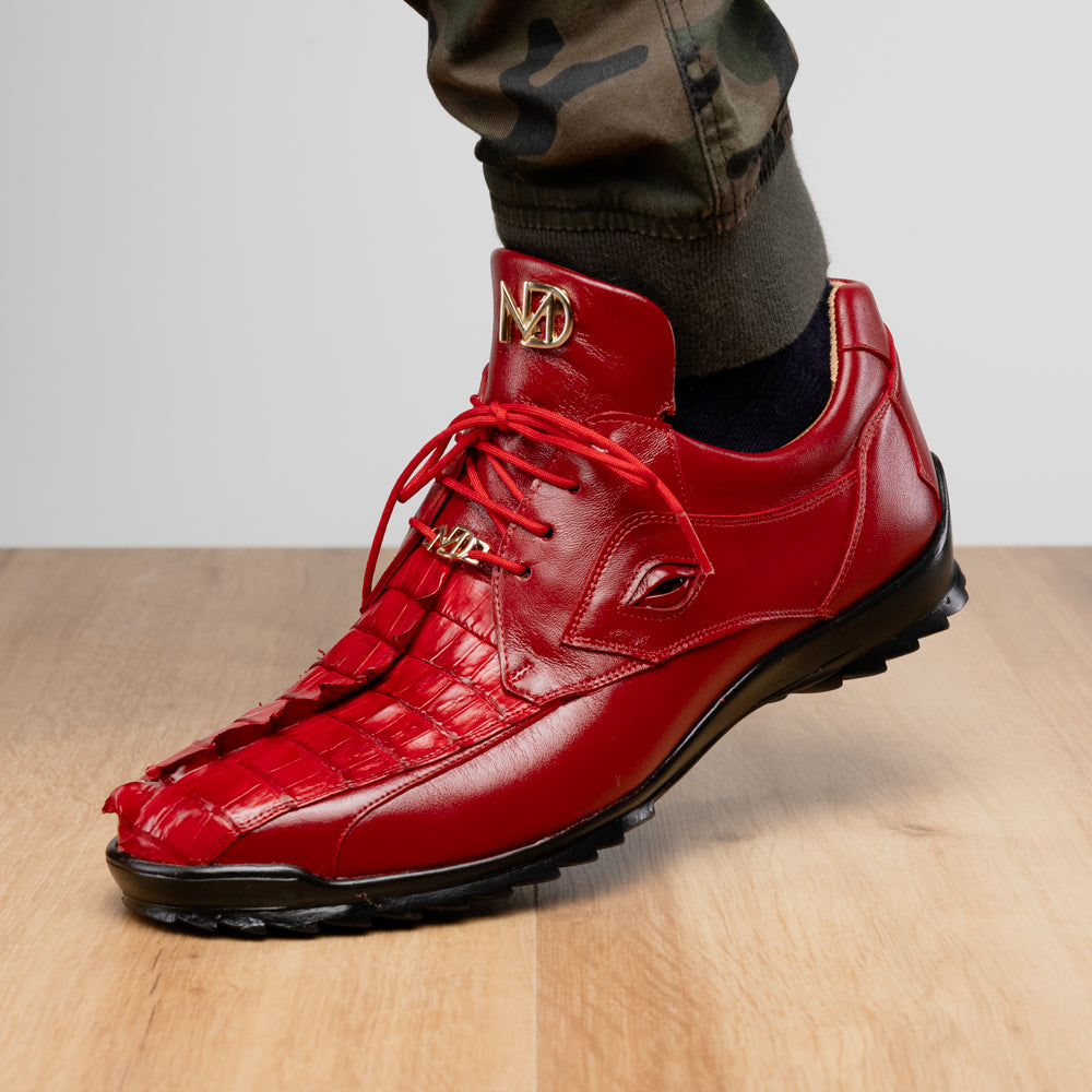 A pair of Marco Di Milano Udine Red glossy hornback caiman sneakers with lace-up fronts, featuring textured detailing and black rubber soles, one luxury men’s sneaker resting elegantly on the other.