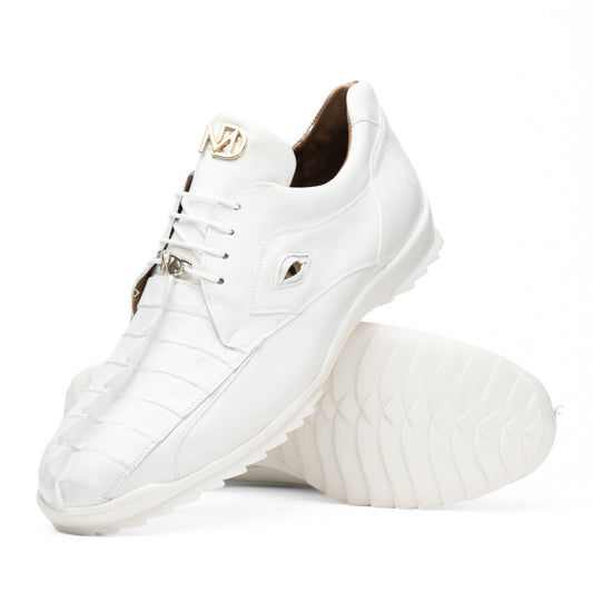 The Udine White by Marco Di Milano is a pair of luxury men’s sneakers crafted from white hornback caiman leather with a distinctive crocodile pattern, featuring a gold logo on the tongue and textured rubber soles. Displayed with one shoe upright and the other leaning against it, this footwear exudes sophistication and unique style.