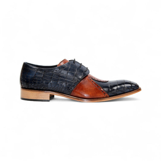 The Duca Di Matiste Duca Valentano Navy/Brandy is a men’s dress shoe in navy with brandy accents, crafted from genuine leather with croco embossing, laces, and a wooden sole, shown in profile against a white background.