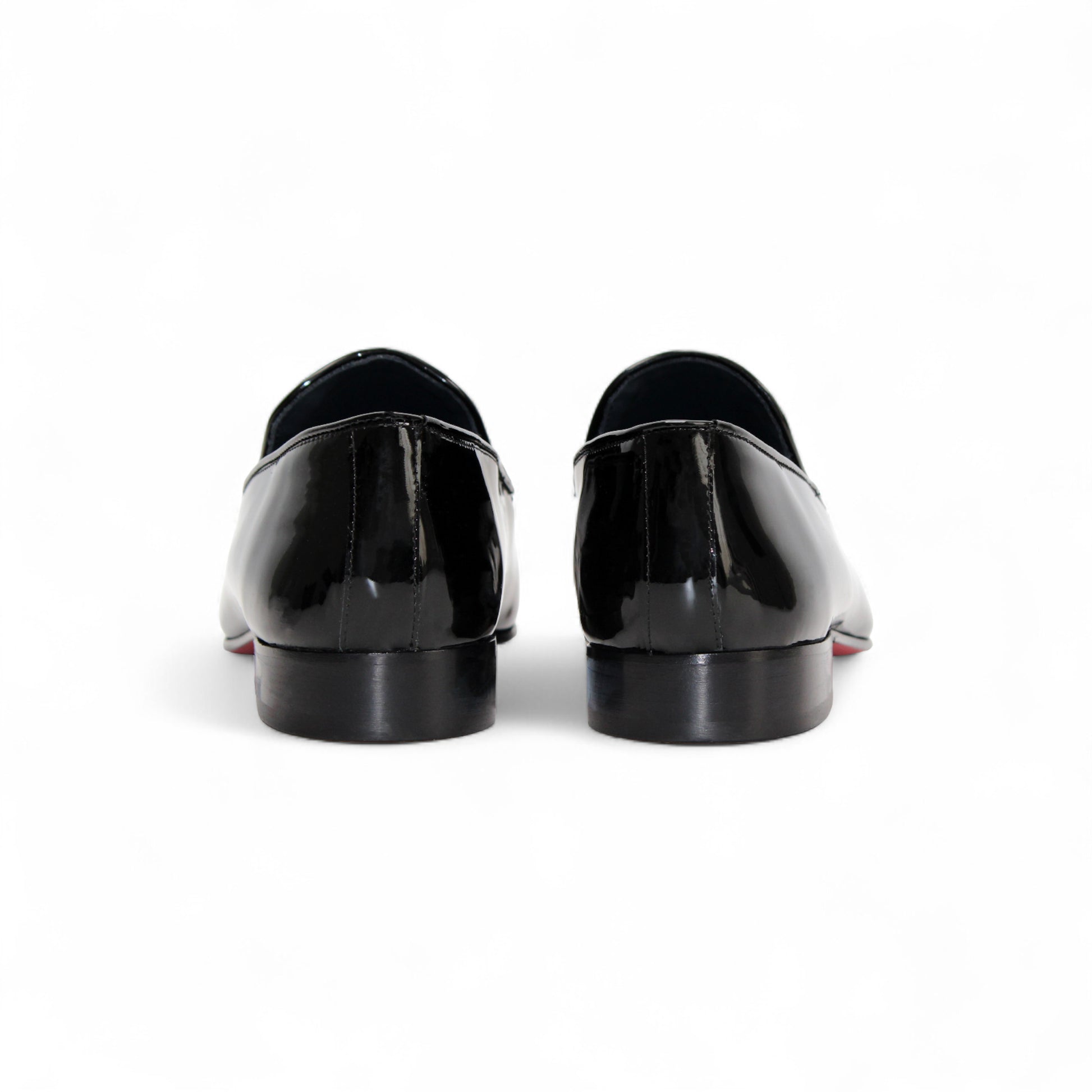 The Duca Di Matiste Duca Valenza Black is an Italian patent leather loafer with a low heel and metal horsebit detail, shown in side profile on a white background—an elegant, timeless designer shoe.