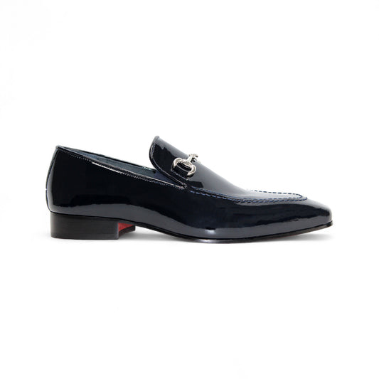 The Duca Valenza Navy by Duca Di Matiste is a navy Italian patent leather loafer with a silver buckle and low heel, shown on a white background—a refined pick for those who appreciate modern elegant shoes.