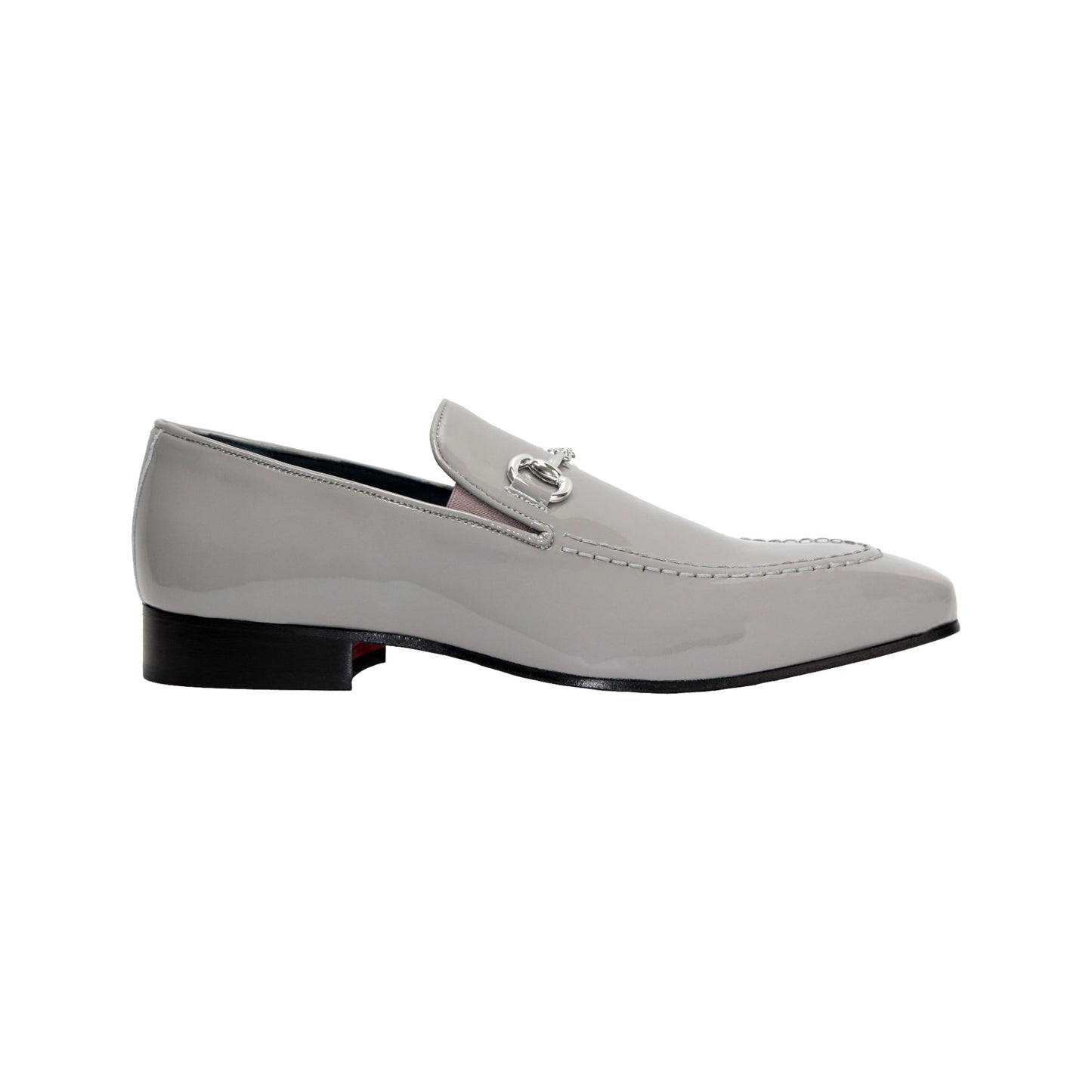 The Duca Di Matiste Duca Valenza Grey loafer features a glossy light gray finish, metal bit detail, black sole, and low heel—exemplifying Italian craftsmanship in luxury footwear. Shown in side profile on a white background.
