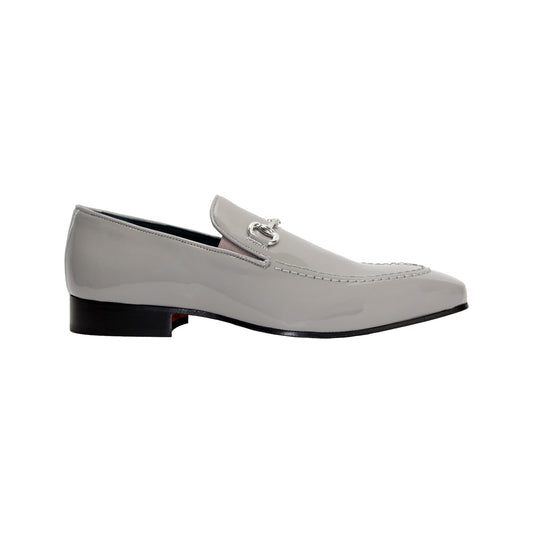 The Duca Di Matiste Duca Valenza Grey loafer features a glossy light gray finish, metal bit detail, black sole, and low heel—exemplifying Italian craftsmanship in luxury footwear. Shown in side profile on a white background.