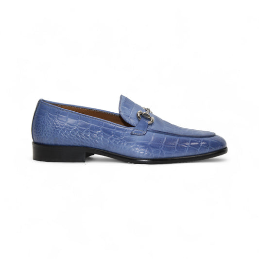 The Duca Vasto Light Blue by Duca Di Matiste is an Italian-crafted shoe in blue genuine croco-embossed leather with a silver metal buckle, shown in profile on a white background.