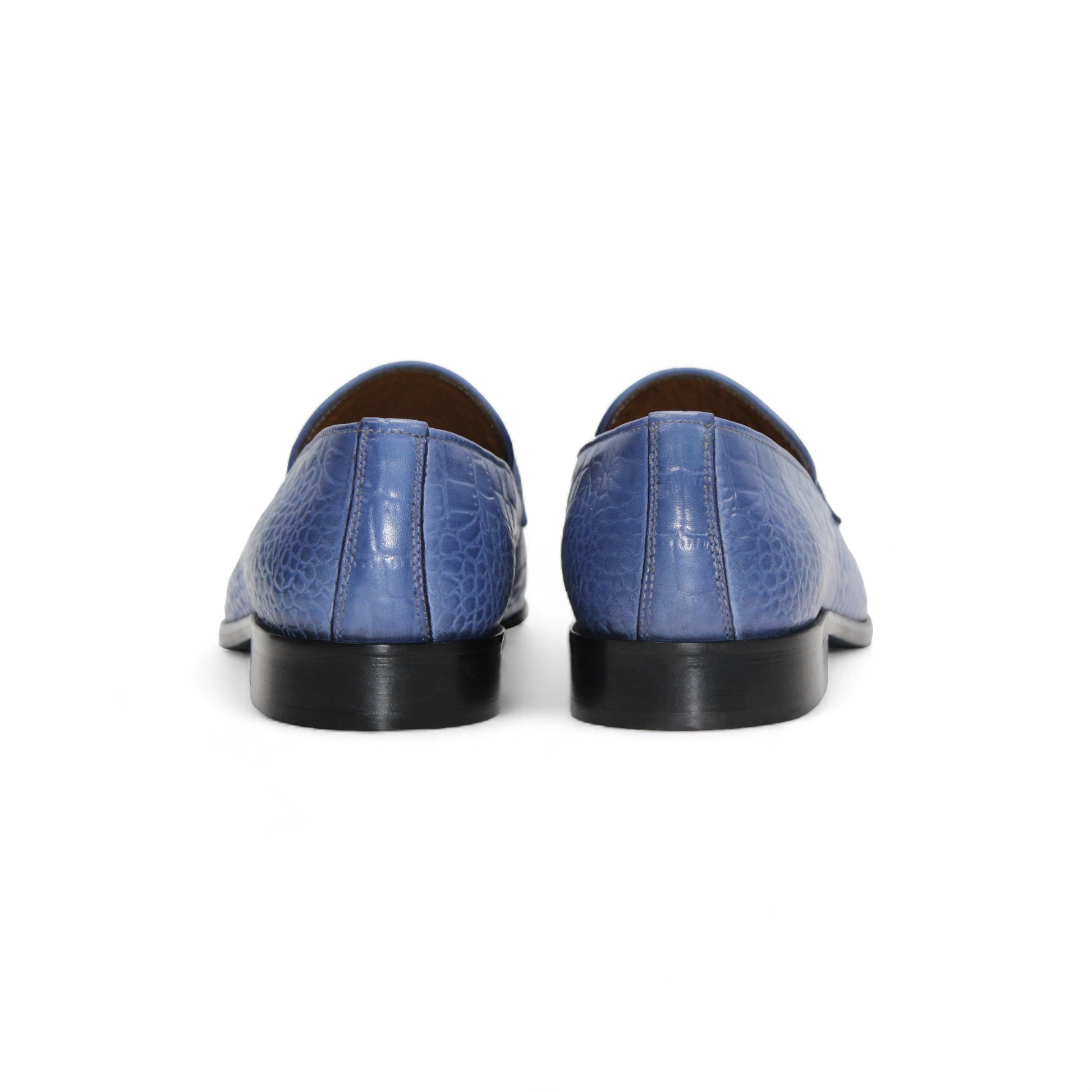 The Duca Vasto Light Blue by Duca Di Matiste is an Italian-crafted shoe in blue genuine croco-embossed leather with a silver metal buckle, shown in profile on a white background.